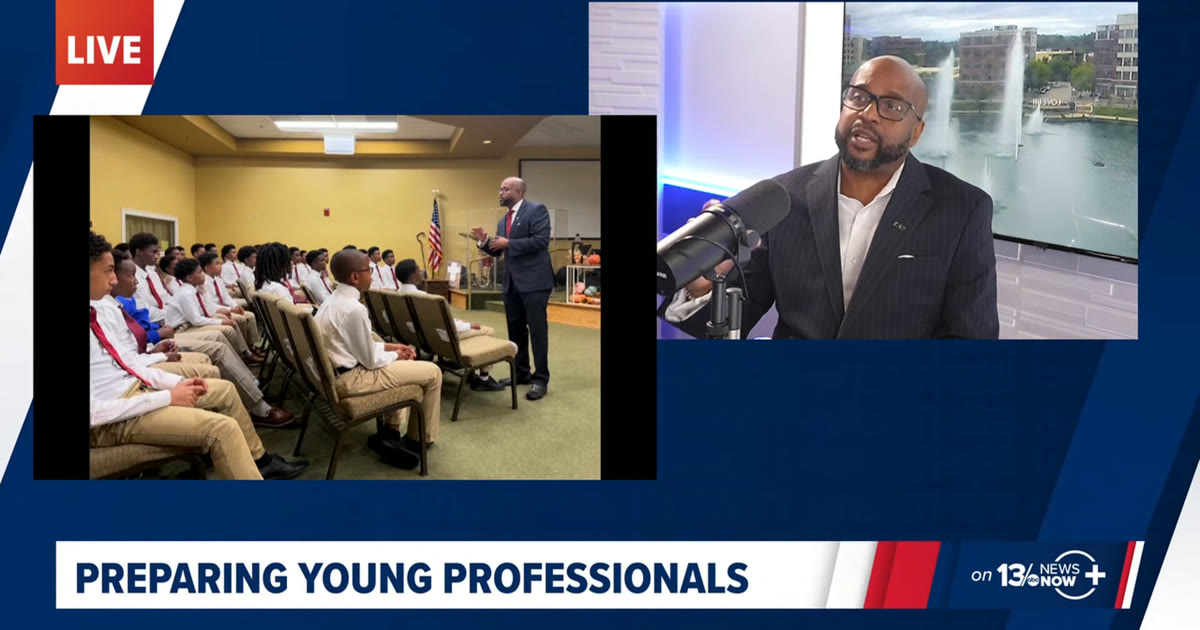Split screen on 13News Now: Dr. Kester Crosse at the studio microphone, beside a photo of him speaking to a room of young men in white shirts and ties