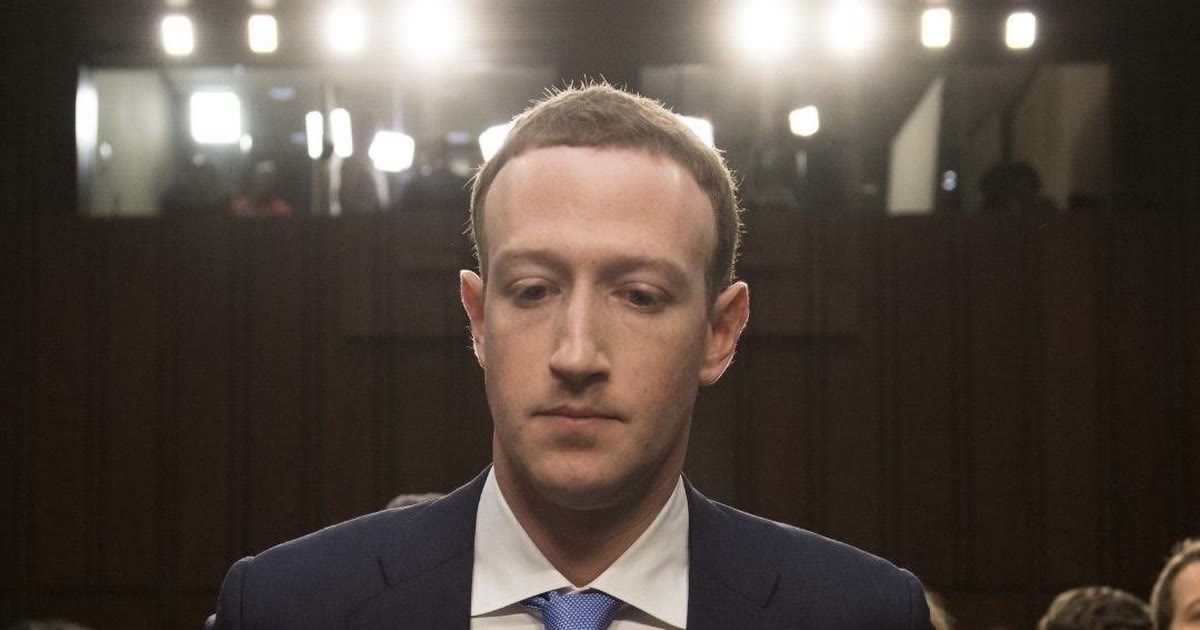 Mark Zuckerberg at the witness table under bright hearing lights at the U.S. Senate, April 10, 2018