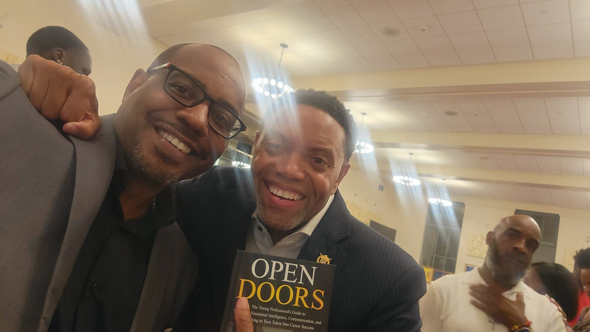 Dr. Maasi J. Smith with Rick Deadwyler, holding Open Doors at the launch