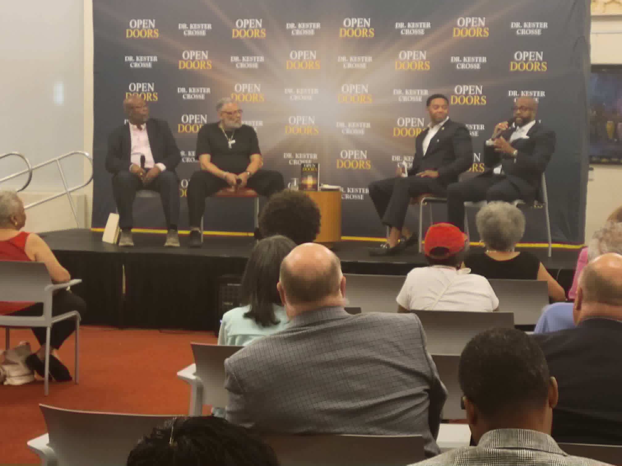 The Open Doors panel at the Wilmington Public Library, with the fathers, Dr. Crosse, and Rick Deadwyler moderating